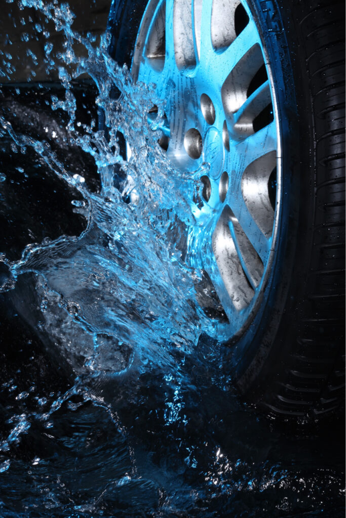 Car's wheel with blue water